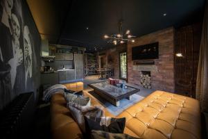 a living room with a couch and a table at The Bells - Luxury Serviced Apartments in Leeds