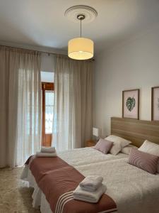 Posteľ alebo postele v izbe v ubytovaní Apartamento Camberos Antequera