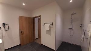 a bathroom with a shower and a walk in shower at Hotel Krupp in Bad Neuenahr-Ahrweiler