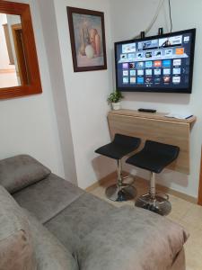 Telewizja i/lub zestaw kina domowego w obiekcie Rico Apartaments Ricosol