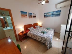 Łóżko lub łóżka w pokoju w obiekcie Rico Apartaments Ricosol