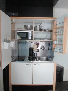 Virtuvė arba virtuvėlė apgyvendinimo įstaigoje Guest House Feliz