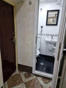 a bathroom with a toilet and a sink at тихий дворик in Baku