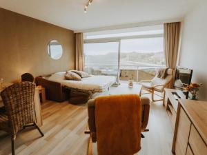 Area soggiorno di Studio Zeeduin by Interhome