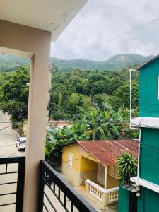 a view from a balcony of a house at J&W apartment in San Felipe de Puerto Plata