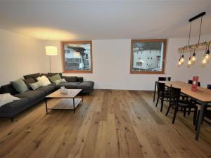 a living room with a couch and a table at Apartment Uehlinger Rosana by Interhome in Lenzerheide