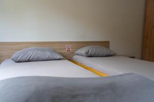 Posteľ alebo postele v izbe v ubytovaní Apartment Eurho