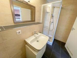 a bathroom with a sink and a shower at Holiday Home Knapp by Interhome in Breisach am Rhein +18 photos