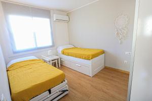 Postel nebo postele na pokoji v ubytování LITORAL COSTA DORADA - LAS TERRAZAS Only families