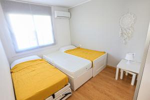 Postel nebo postele na pokoji v ubytování LITORAL COSTA DORADA - LAS TERRAZAS Only families