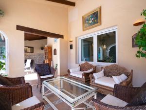 a living room with chairs and a glass table at Villa Marita by Interhome in Moraira
