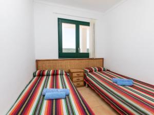 Posteľ alebo postele v izbe v ubytovaní Holiday Home Garbinell II by Interhome
