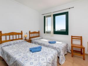 Posteľ alebo postele v izbe v ubytovaní Holiday Home Garbinell II by Interhome