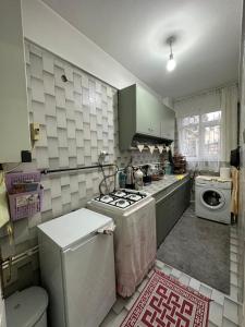 a kitchen with a sink and a stove top oven at Nur home1 Abuzer Yegin in Istanbul