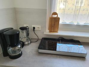 a kitchen counter with a toaster and a coffee maker at modern und mittendrin, das ist Monty in Wittenberge