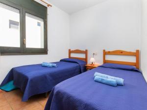 Posteľ alebo postele v izbe v ubytovaní Holiday Home Port del Rei I by Interhome