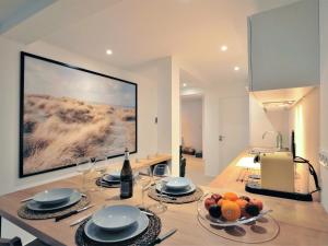 Televízia a/alebo spoločenská miestnosť v ubytovaní Apartment L'Appart'Mer by Interhome