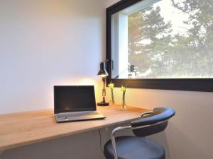 Televízia a/alebo spoločenská miestnosť v ubytovaní Apartment L'Appart'Mer by Interhome