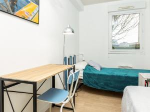 Łóżko lub łóżka w pokoju w obiekcie Apartment Les Caps Horniers by Interhome
