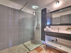 a bathroom with a sink and a shower at Holiday Home Les Oyats by Interhome in Dolus d'Oléron
