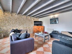 a living room with two couches and a tv at Holiday Home Les Oyats by Interhome in Dolus d'Oléron