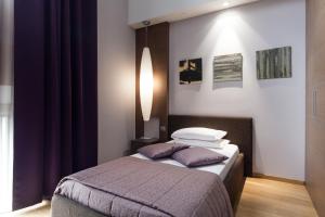 Postel nebo postele na pokoji v ubytování Hotel Michelangelo