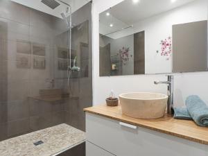 a bathroom with a sink and a shower at Apartment Le Mascoïnat by Interhome in Nice