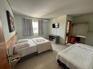 Voodi või voodid majutusasutuse HOTEL EXPRESS LORENZETTI toas