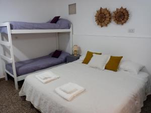 a bedroom with two bunk beds and a ladder at Cacique Catriel "PLANTA BAJA" check-in flexible in Catriel
