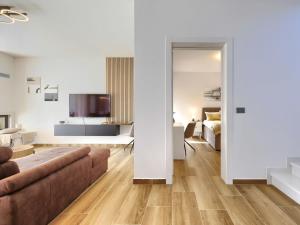 a living room with a couch and a bedroom at Villa Prudensia by Interhome in Kaštelir +45 photos