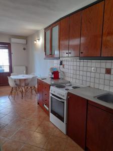 Kuchyň nebo kuchyňský kout v ubytování cosy home
