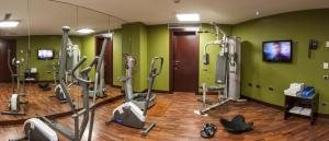 a gym with a bunch of exercise bikes in a room at Zenit Lleida in Lleida