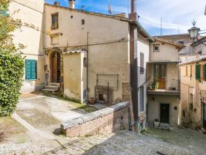 an old house in an alley in an old town at Holiday Home Casa Campau by Interhome in Montepulciano