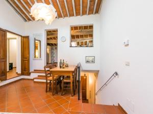 a kitchen and dining room with a table and chairs at Holiday Home Casa Campau by Interhome in Montepulciano