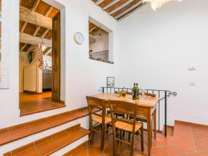 a dining room with a wooden table and chairs at Holiday Home Casa Campau by Interhome in Montepulciano +30 photos