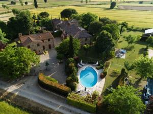 an aerial view of a house with a swimming pool at Holiday Home Casale il Giglio by Interhome in Ciggiano