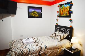 Voodi või voodid majutusasutuse Qolmay Hostel Cusco toas