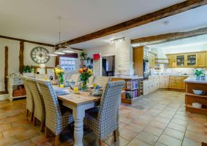 a kitchen and dining room with a table and chairs at Street Farm-Metfield in Metfield