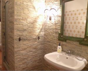 a bathroom with a sink and a mirror at Villa Chiarenza Maison d'Hotes in Giardini Naxos +56 photos