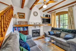 a living room with a couch and a fireplace at La Isla Casa Barnaby in Platja de l'Arenal