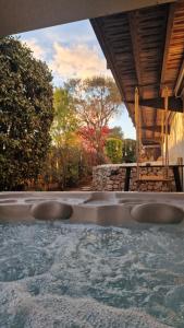a group of sinks in a swimming pool at Chambre d'hôte Cigale jacuzzi et jardin privé in Allauch