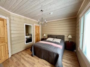 Postel nebo postele na pokoji v ubytování Villa Aleksandra, LaatuLomat