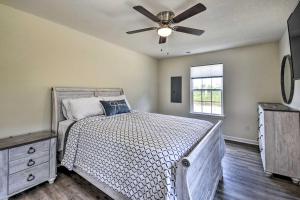 a bedroom with a bed with a ceiling fan at Cozy Cape Charles Apartment Walk to Beaches! in Cape Charles
