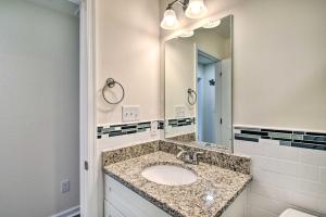 a bathroom with a sink and a large mirror at Cozy Cape Charles Apartment Walk to Beaches! in Cape Charles +18 photos