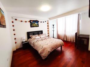 Voodi või voodid majutusasutuse Qolmay Hostel Cusco toas
