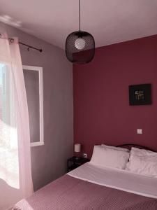 A bed or beds in a room at Angie's Home