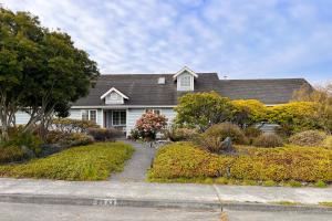 a white house with a landscaping in front of it at Good Fortune in McKinleyville