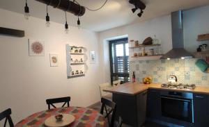 a kitchen with a table and a counter top at Beautiful seaside 2 bedroom apartment Babina in Rabac