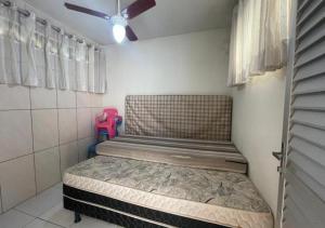 Кровать или кровати в номере Ervino Praia Flat