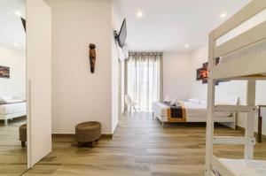 a bedroom with two beds and a bunk bed at Il Giramondo in Agropoli